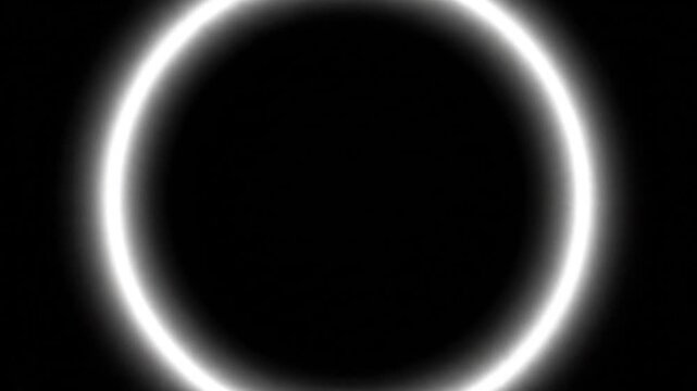 A video showcasing a stunning solar eclipse with a bright ring of light against a dark background