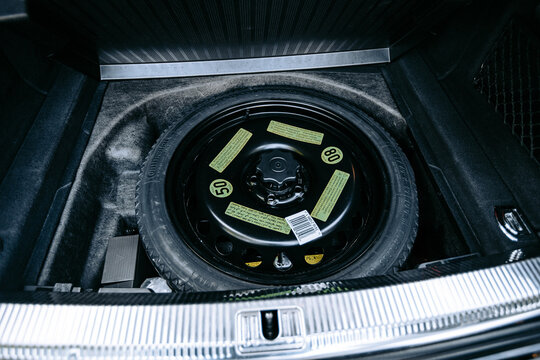 Vinnytsia; Ukraine; October 07, 2020: Spare tire Continental in a secret place in the trunk of an Audi car