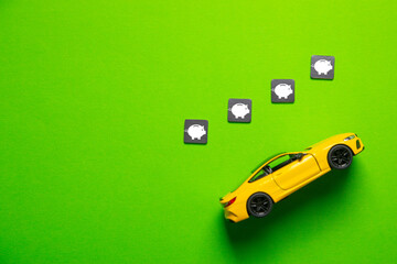 Toy car model with a piggy bank symbols.