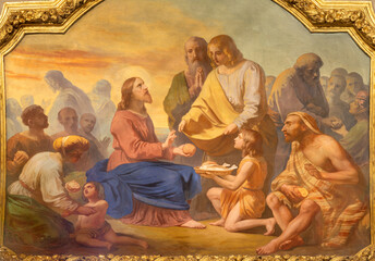 Naklejka premium VIGEVANO, ITALY - JANUARY 18, 2026: The fresco of The Miracle of Multiplication in the Cathedral of St. Ambrose by Francesco Gonin (1858).