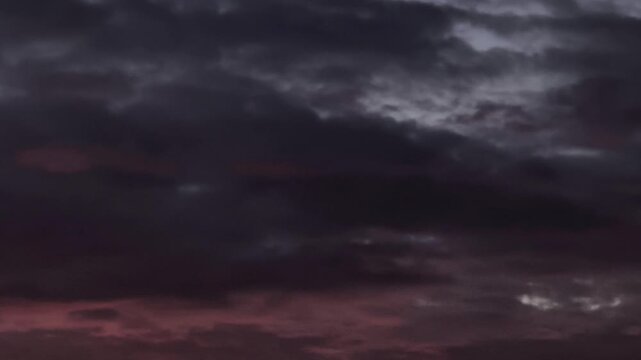Dark and pink cirrocumulus clouds at dusk