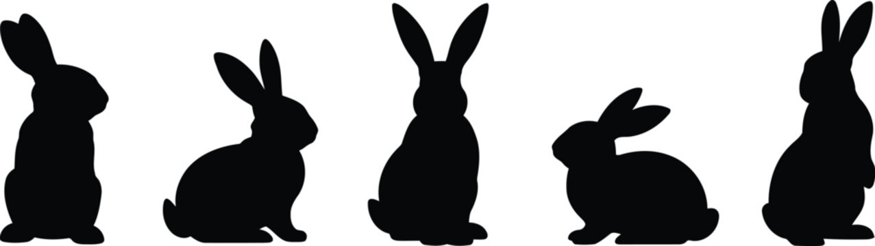 Set of five black rabbit silhouettes on white background