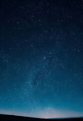 Obraz premium Experience the profound beauty of the night sky, a boundless canvas painted with countless twinkling stars, evoking a sense of cosmic wonder and serene tranquility