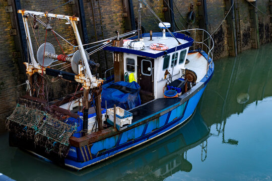 Whitstable Harbour in the morning with docked boats