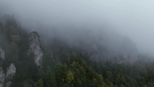 Time-lapse video of fog flowing over a rocky cliff