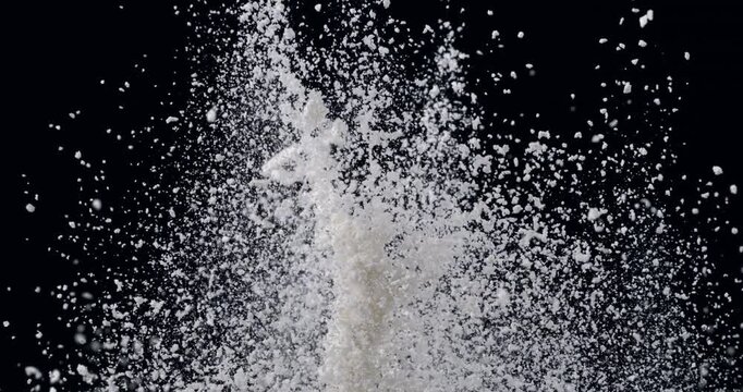Slow Motion Flour Powder Explosion On Black Background With Flying White Particles. Baking Ingredient Cloud, Abstract Food Texture, Dramatic Cinematic Dust Burst