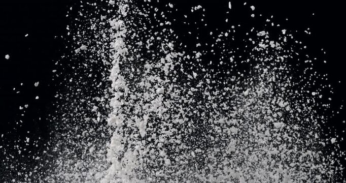 Slow Motion Flour Powder Explosion On Black Background With Flying White Particles. Baking Ingredient Cloud, Abstract Food Texture, Dramatic Cinematic Dust Burst