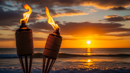 Tiki torches ablaze on a serene beach at sunset with waves gently lapping the shore