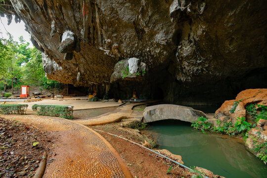 Scenic limestone cave Tham Phung Chang entrance with greenery in phang nga, thailand
