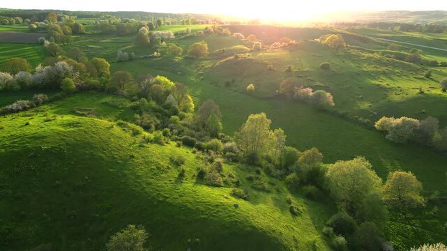 Aerial of Skane rolling hills during sunset Sweden