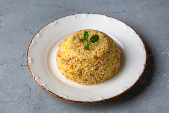 Traditional delicious Turkish food, bulgur pilaf with vermicelli (Turkish name; arpa sehriyeli bulgur pilavi)