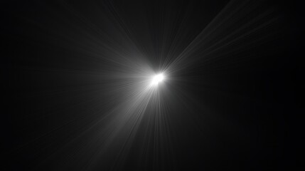 Fototapeta premium Bright white light radiating from the center with rays extending outward on a black background creating a dramatic visual effect
