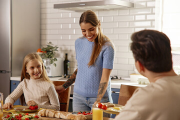 Happy School Morning: Mom Helps Daughter with Backpack