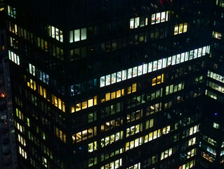 Fototapeta premium CLOSE UP Offices are still illuminated at night in New York business district