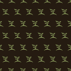 Inspiring pattern of small green seedlings sprouting from mounds of dark soil on a chocolate background representing growth and nature