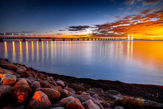 One of the longest bridges in Europe, Cable-Stayed Bridge &Oslash;resund during sunset, building structure connecting two cities, Malm&ouml;, Sweden, Scandinavia.