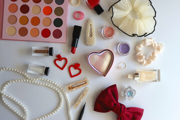 Various accessories and beauty products on white background. Coquette aesthetic. Flat lay.