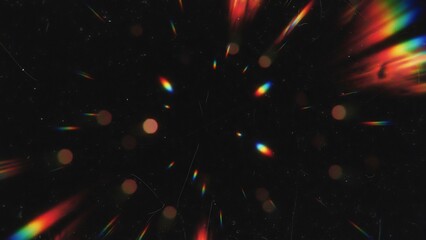 Vibrant rainbow light streaks and bokeh particles on a dark background creating a festive atmosphere with colorful abstract shapes and dynamic motion blur