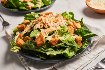 Classic caesar salad with grilled chicken fillet and parmesan cheese.