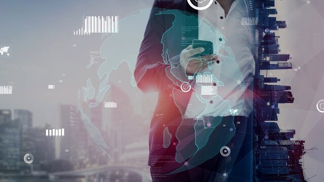 A businessman stands with a smartphone in hand, surrounded by digital data visualization and global connections over an urban cityscape, symbolizing modern finance and technology. Xenic - Powered by Adobe