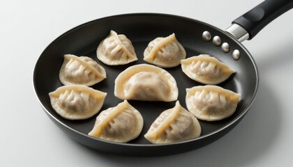 Raw Dumplings In Skillet