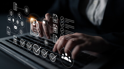 A person types on a laptop, surrounded by digital icons and graphics that represent data management, project workflow, and innovative technology in a modern workspace. Gantry
