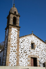 Fototapeta premium Sanctuary of San Andrés de Teixido, perched on cliffs of A Capelada Mountains, Galicia, Spain. A mystical coastal pilgrimage site rich in legend and nature.