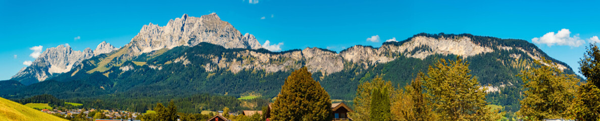 High resolution stitched alpine summer panorama with Mount Wilder Kaiser seen from Sankt Johann in Tirol, Kitzbuehel, Tyrol, Austria