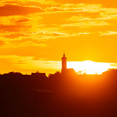 Megazoom (600mm) summer sunset or sundowner with a church silhouette near Toeding, Thuernthenning, Moosthenning, Dingolfing, Landau, Bavaria, Germany