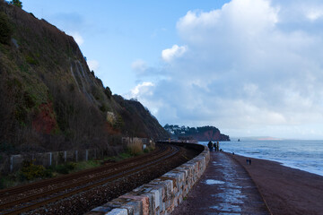 Obraz premium Coastal railway line by the beach, Teignmouth, Devon, England