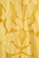 Yellow floral lace shirt and jacket pair on a mannequin