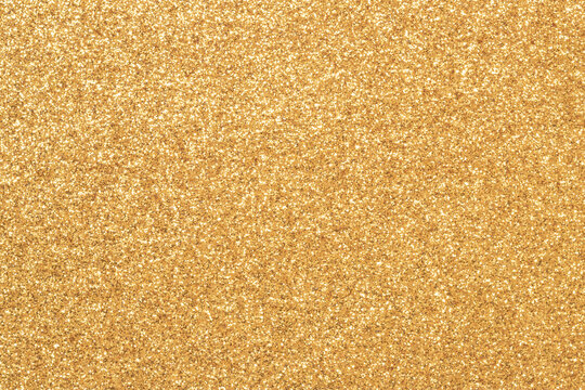 A rich gold glitter texture fills the frame, creating a luxurious and festive backdrop ideal for branding, invitations, posters, and digital art. Sparkling surface conveys glamour, and celebration.