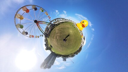 "Tiny Planet" 360 degree image of Coachman Park giant Duck and Ferris wheel