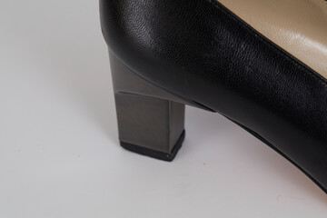 Metallic and leather shoe on a white background