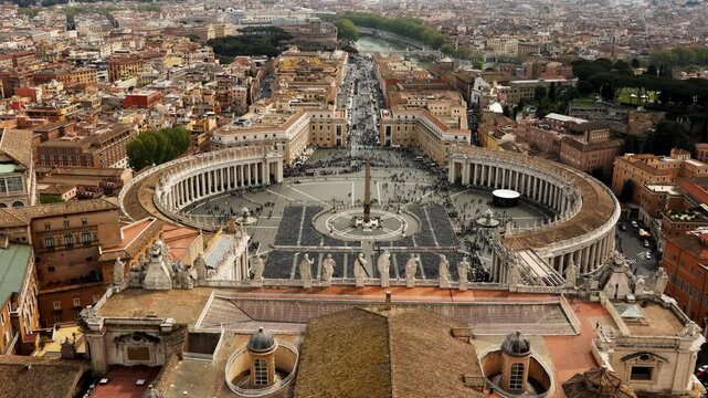 Vatican City Rome Italy panoramic view from St Peter Basilica dome looking down at square Piazza San Pietro and statues skyline travel tourism landmark