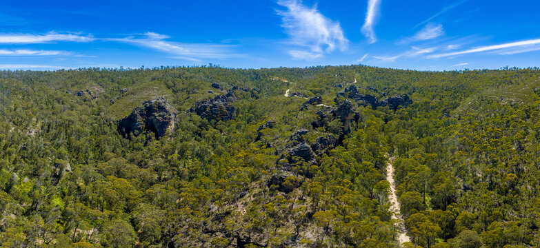 Drone aerial photograph of rock formations in the City of Stones in the Gardens of Stone State Conservation Area near Lithgow in the Central West region of New South Wales, Australia.