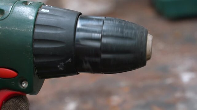 Extreme close-up of a rapidly rotating screwdriver chuck during operation. Professional Power Tool Used For Construction, Carpentry And Home Repair, Ready To Go