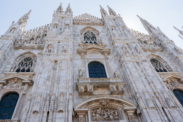 Duomo di Milano square in Milan city. Gothic Italian architecture. Italy. Sculptures and statues facade decor details