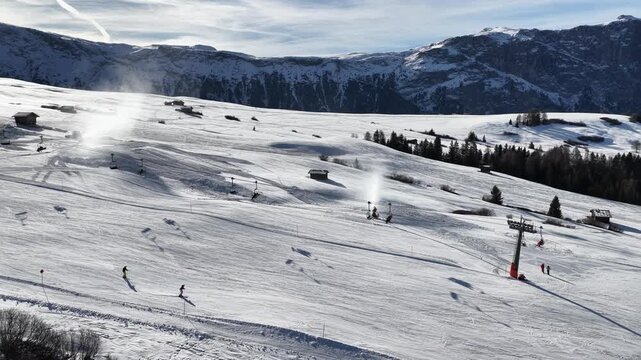 People Skiing and Snowboarding Dolomites Seiser Alm Mountains Views Aerial Video 4K
