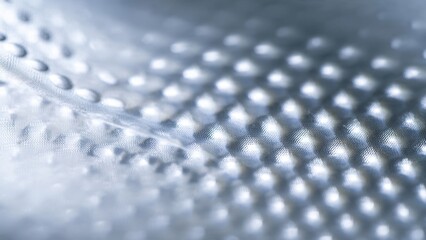 Abstract silver dimpled metallic surface