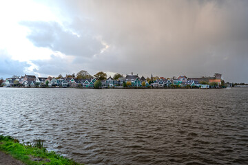 Old houses in Dutch water village of Zaanse Schans building architecture Netherlands. Waterfront landscape.
