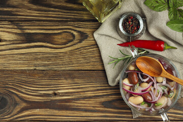Glass Bowl of Pickled Beans with Spices and Herbs