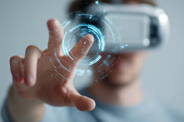 A man is pointing at a virtual reality display with his hand