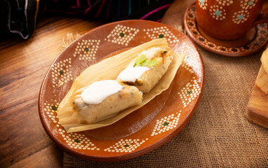 Tamales. Traditional dish typical of Mexico and some Latin American countries. Corn dough wrapped in corn leaves. The tamales are steamed.