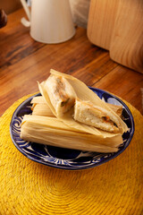 Tamales. Traditional dish typical of Mexico and some Latin American countries. Corn dough wrapped in corn leaves. The tamales are steamed.