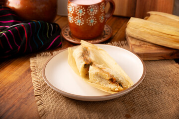 Tamales. Traditional dish typical of Mexico and some Latin American countries. Corn dough wrapped in corn leaves. The tamales are steamed.