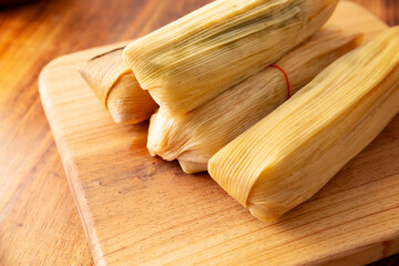 Tamales. Traditional dish typical of Mexico and some Latin American countries. Corn dough wrapped in corn leaves. The tamales are steamed.