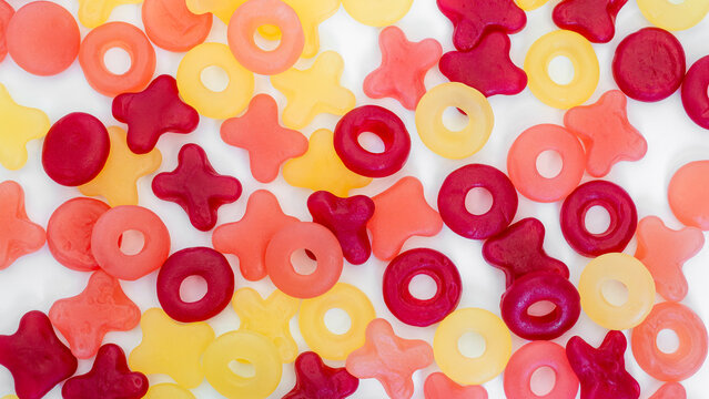 Colorful Valentine Gummy Candies Scattered on White Background (Flat Lay)