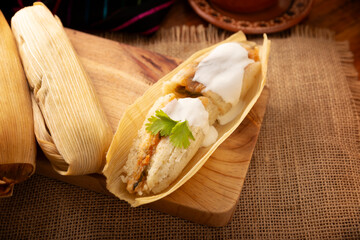 Tamales. Traditional dish typical of Mexico and some Latin American countries. Corn dough wrapped in corn leaves. The tamales are steamed.