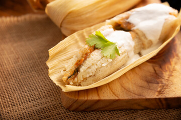 Tamales. Traditional dish typical of Mexico and some Latin American countries. Corn dough wrapped in corn leaves. The tamales are steamed.